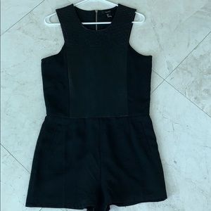 Black romper with faux leather detail
